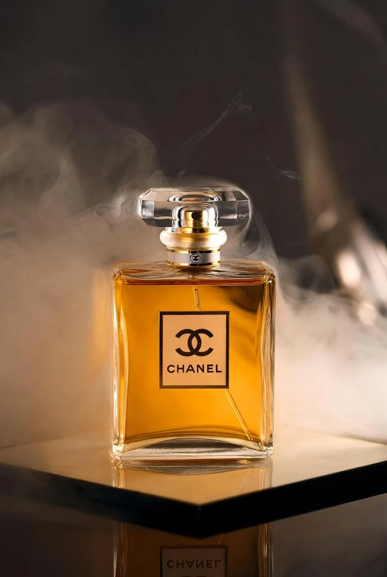 A hyper-realistic studio product shot of a Chanel perfume bottle placed o...