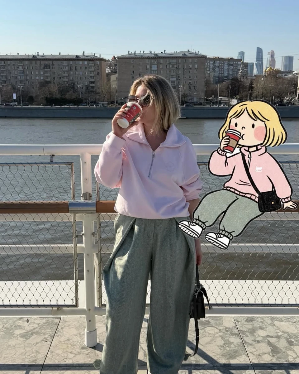 soft candid street photography of a stylish woman standing by a riverside...