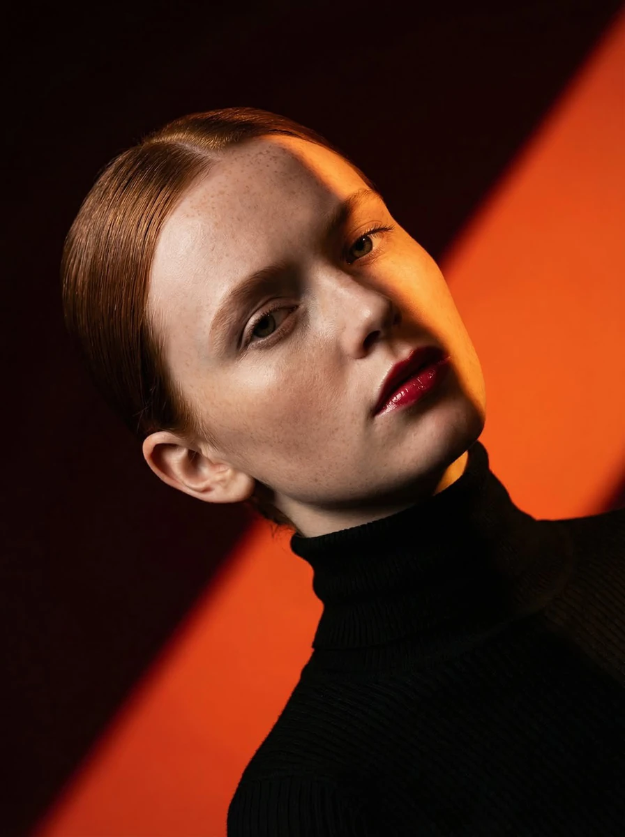 Ultra-high-fashion editorial beauty portrait of a fair-skinned female mod...
