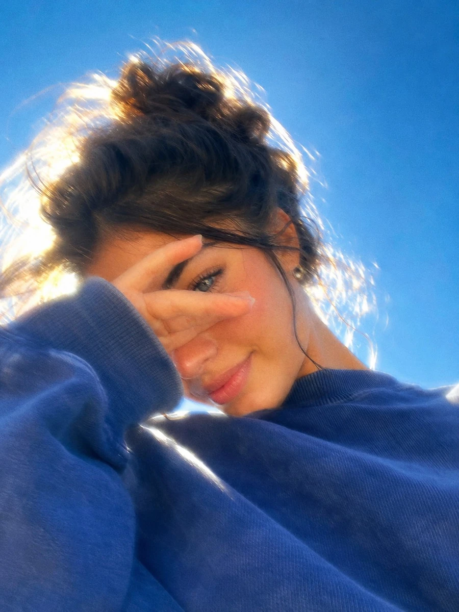 A dreamy, ultra-aesthetic close-up portrait of a beautiful young woman ou...