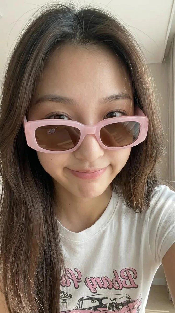 Ultra-realistic casual indoor smartphone photo of a young adult East Asia...