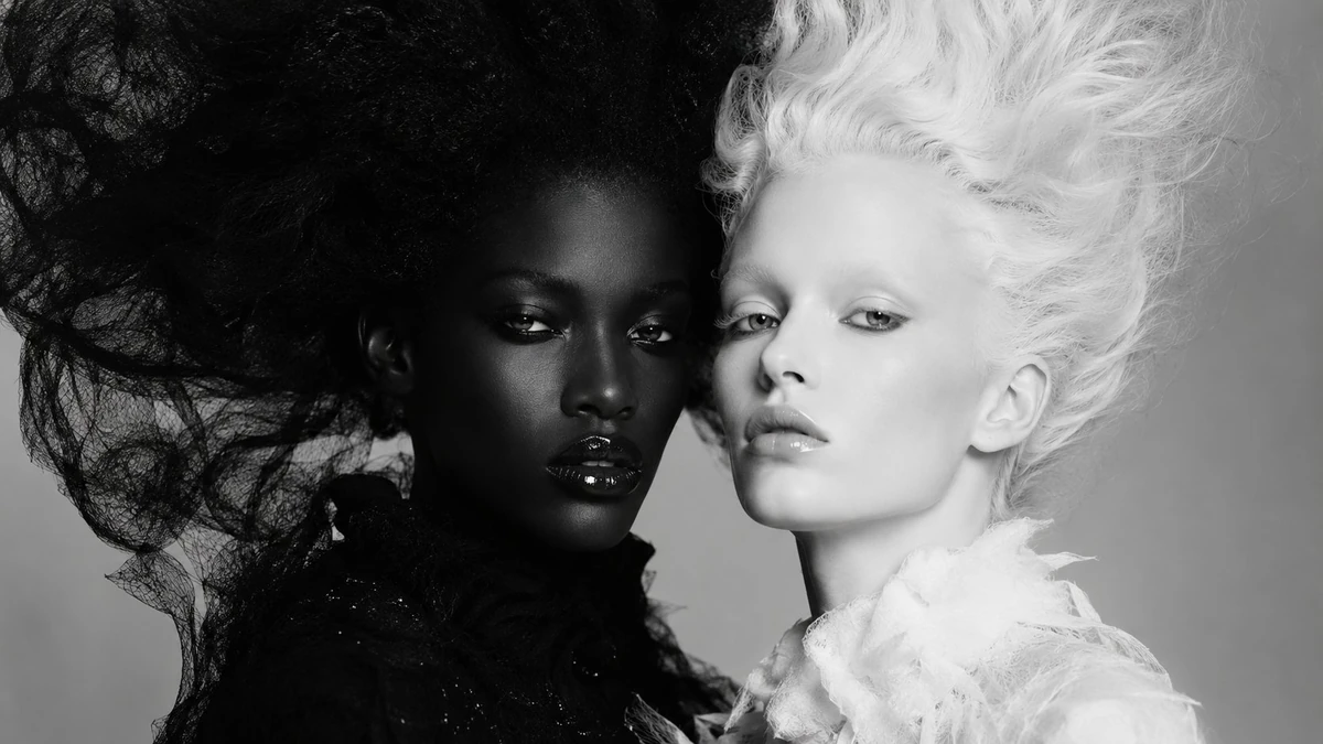 Core Concept: High fashion black and white editorial portrait of two wome...