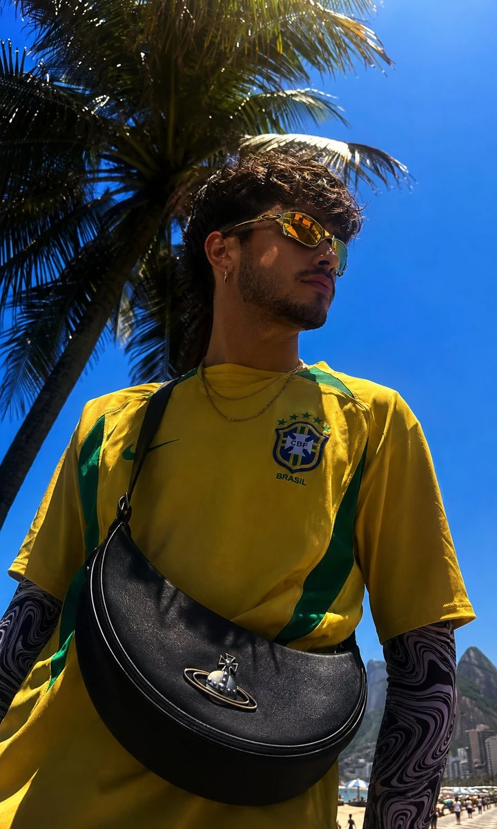 A hyper-realistic vertical 4:5 photograph of Rio de Janeiro's Copacabana...