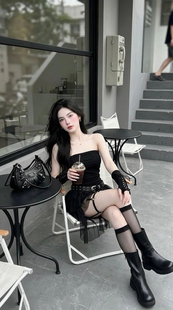 Full body photo of a young woman with long straight black hair, sitting o...