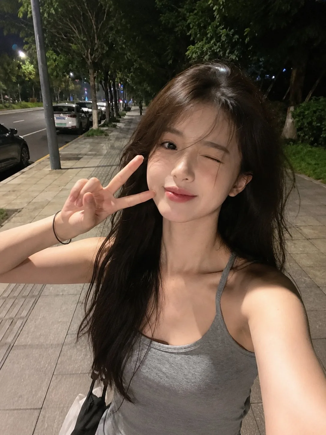 Ultra-realistic smartphone selfie taken with a mobile phone at night, loo...