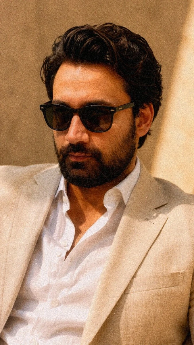 A confident fashion portrait of a person with [YOUR_FACE] wearing black s...