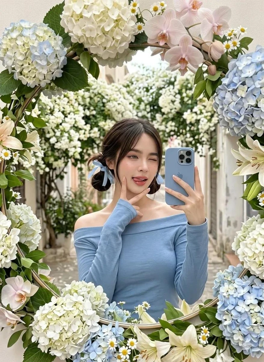A cute young woman taking a mirror selfie outdoors, framed by a decorativ...