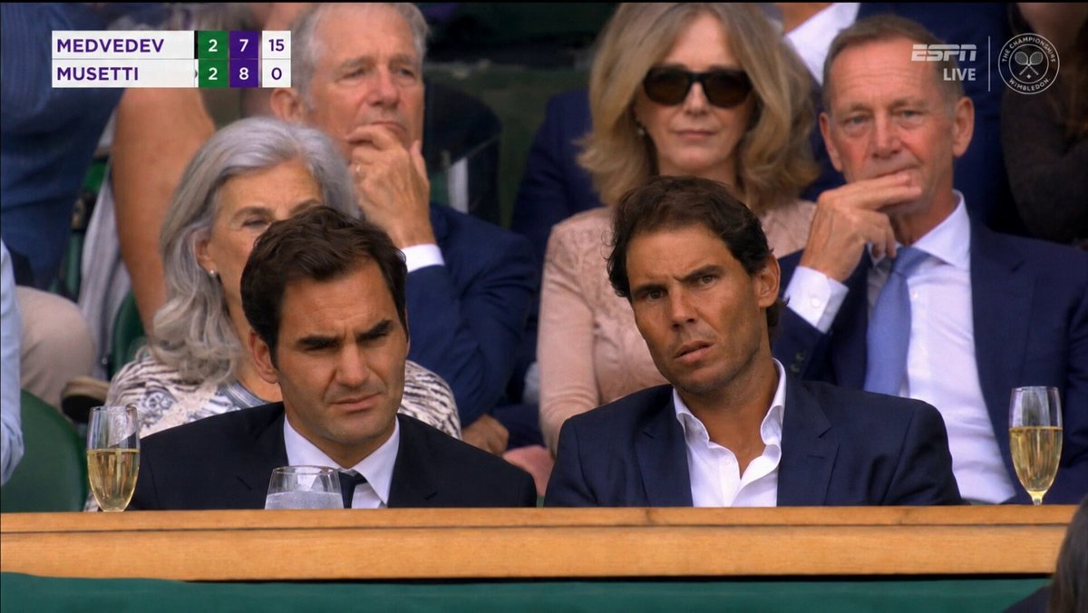 A screenshot from a live Wimbledon TV broadcast during a packed Centre Co...
