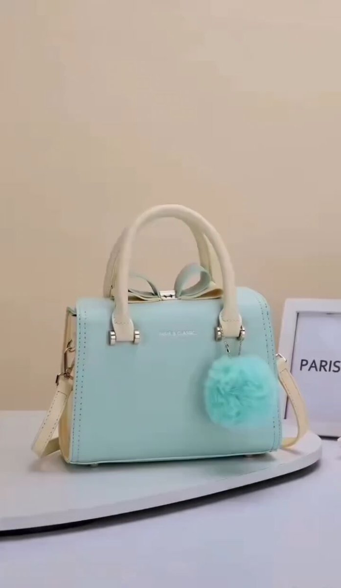 A cinematic luxury handbag commercial featuring an elegant designer leath...