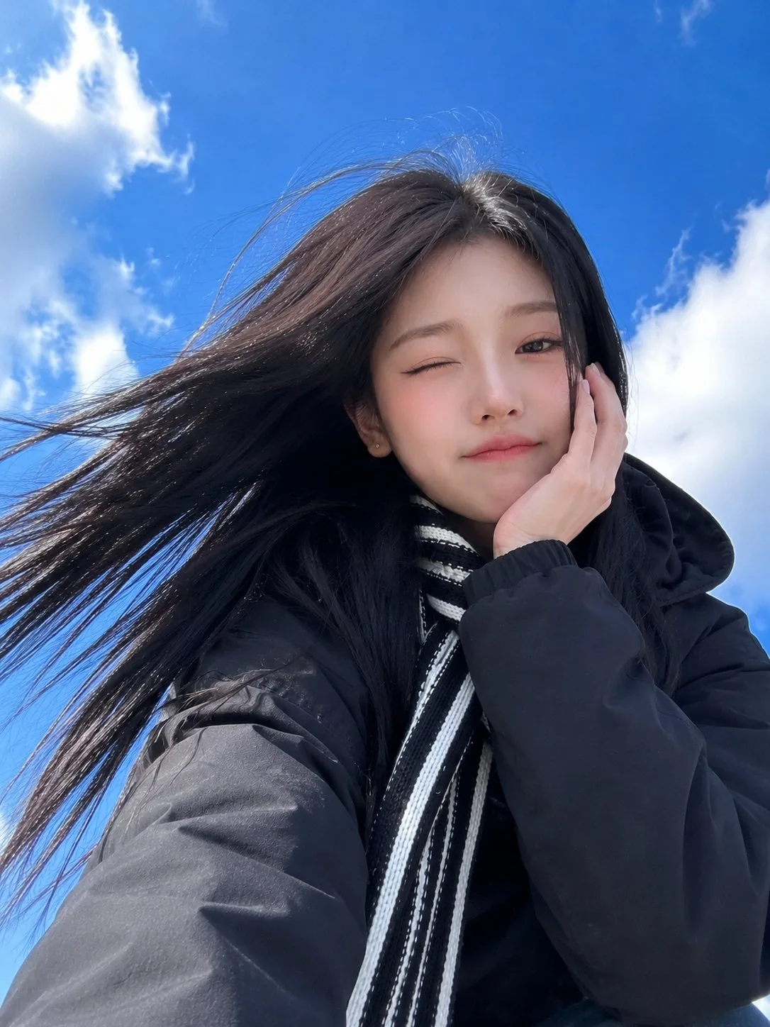 Ultra-realistic smartphone selfie of a beautiful young East Asian woman t...