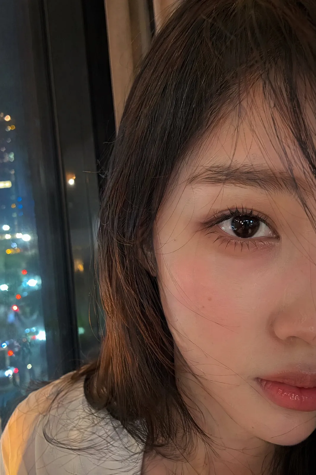 Ultra-realistic smartphone selfie portrait, genuinely photographed on a m...