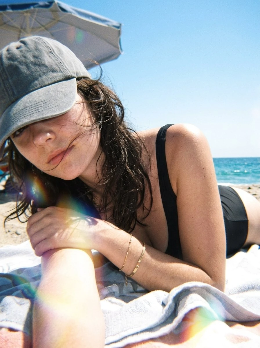 Ultra-realistic candid beach selfie photography, close-up portrait of a b...