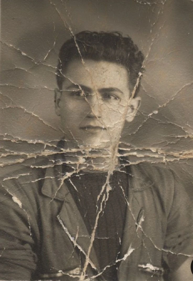 Restore the image while preserving the exact facial identity of the subje...