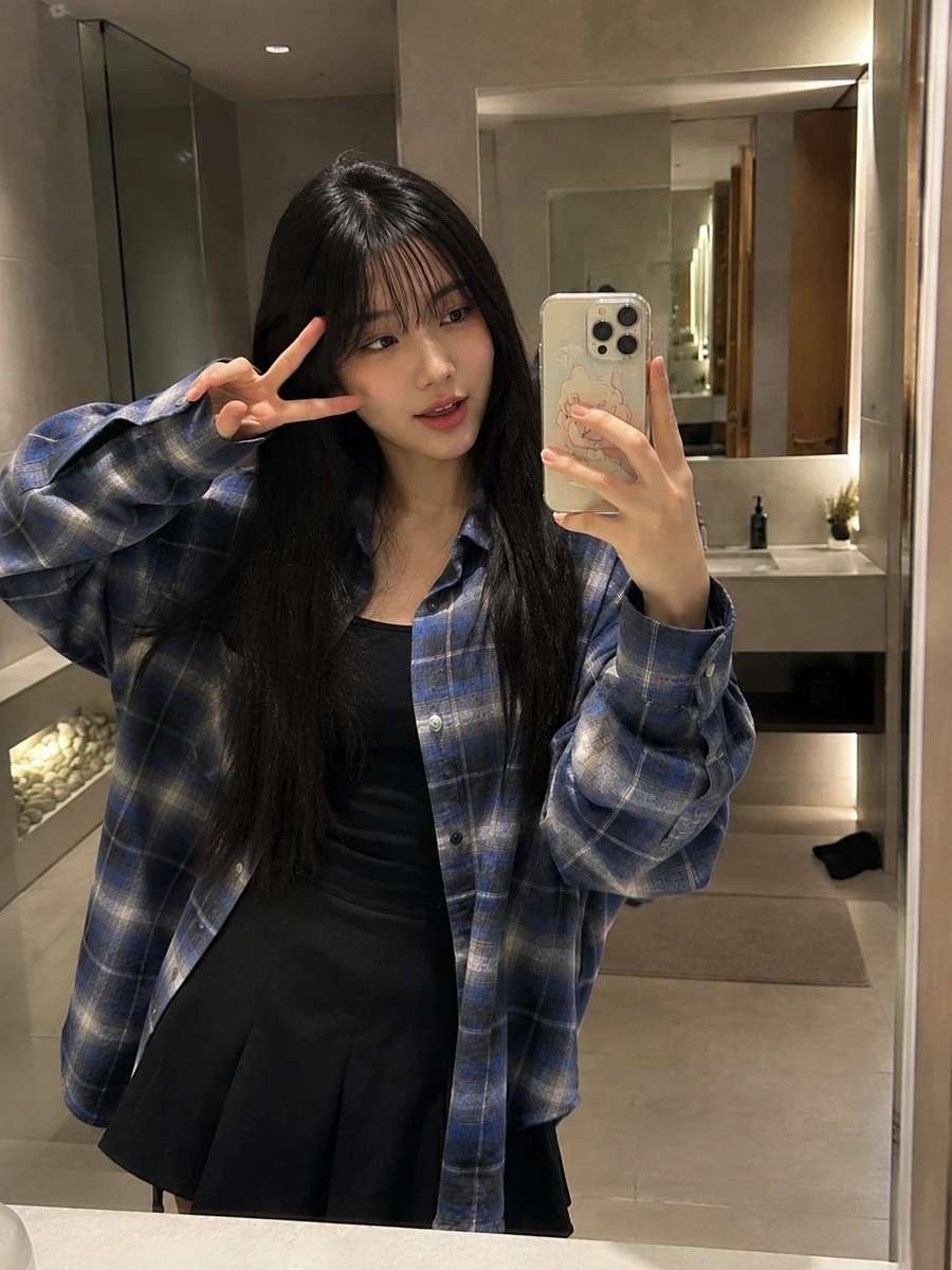Beautiful young Japanese woman with long straight black hair and soft wis...