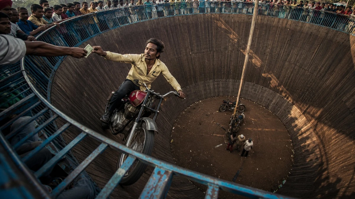 A cinematic wide-angle documentary photograph of a daring motorcycle stun...