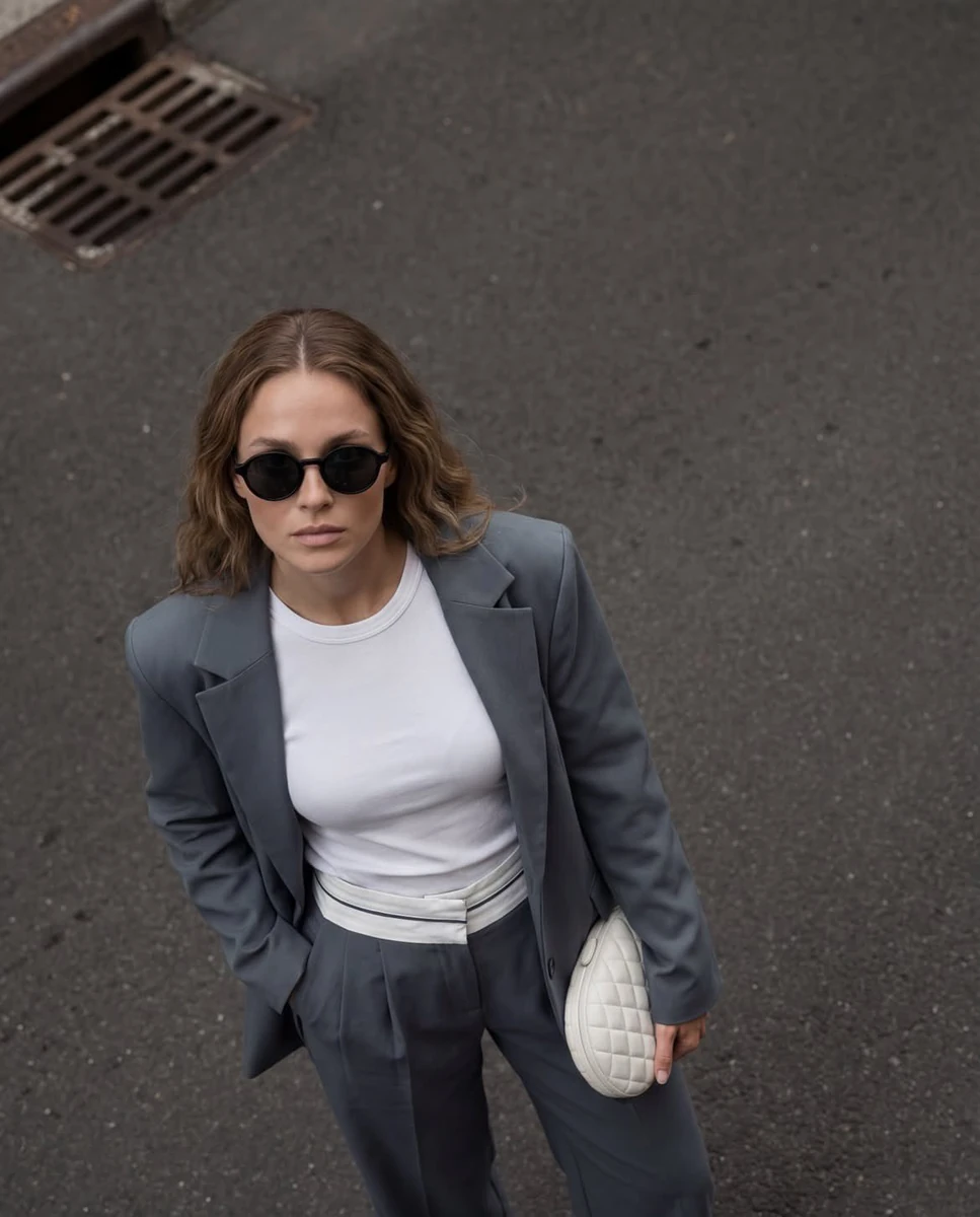 Cinematic street fashion portrait, high-angle top-down perspective, styli...