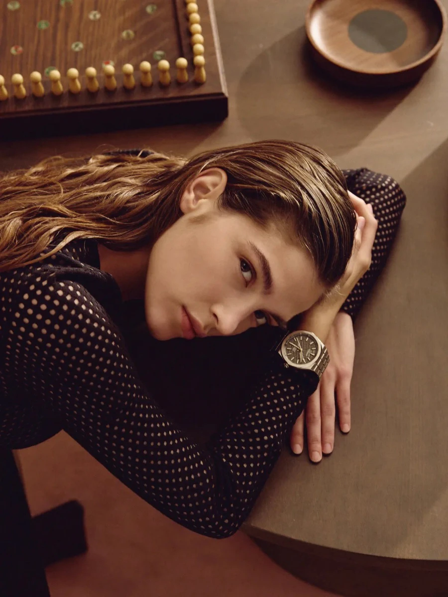 Luxury fashion editorial, close-up portrait of a woman resting her head o...