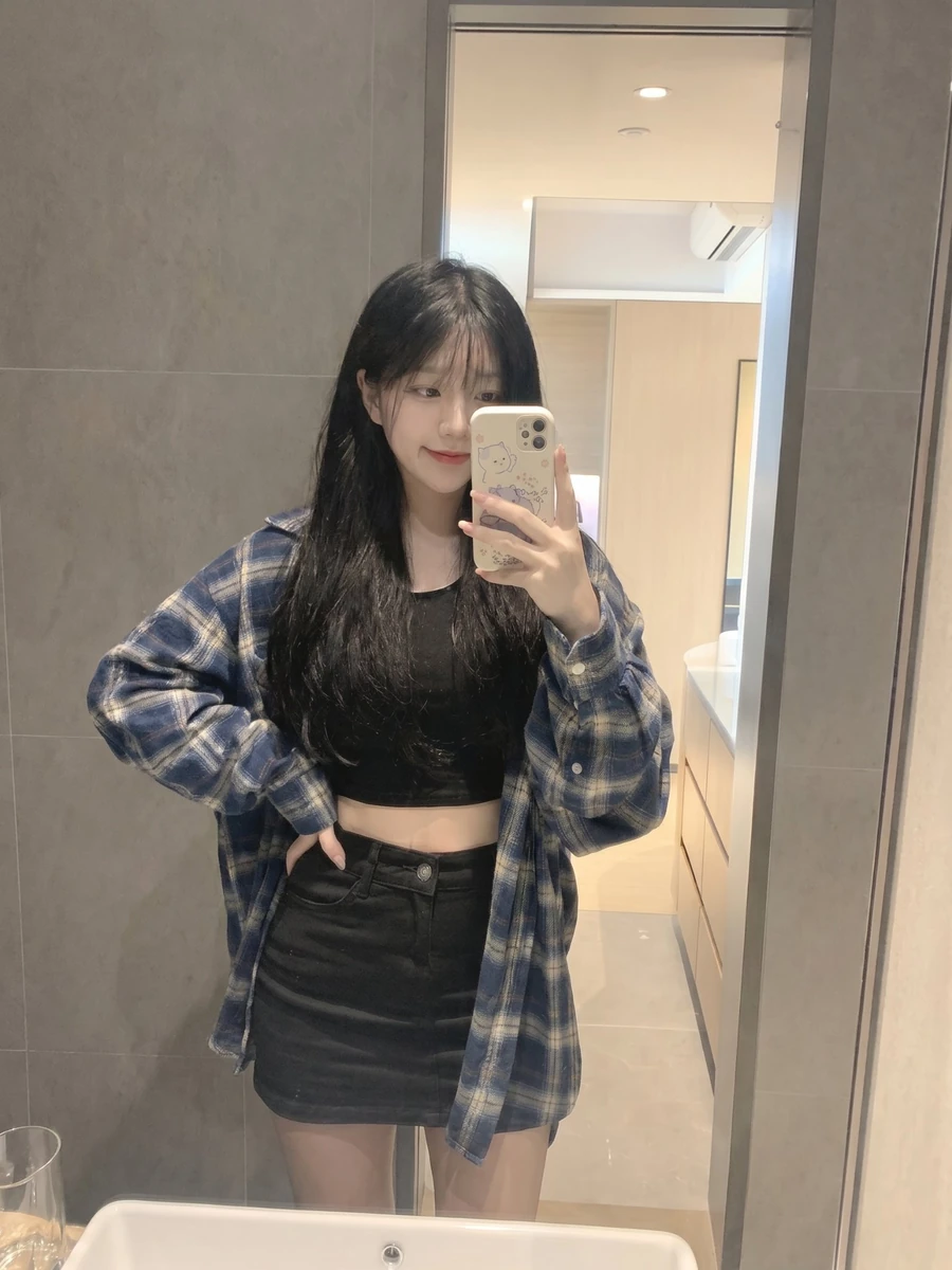 young Japanese girl with long straight black hair and soft wispy bangs, w...