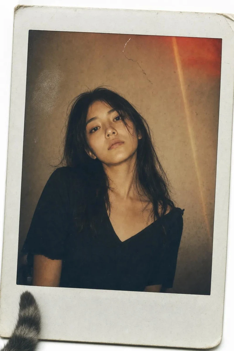 A vintage Polaroid instant photograph with a classic thick white border,...