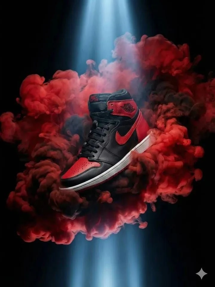 Ultra-dramatic product photography of a black and red high-top sneaker fl...
